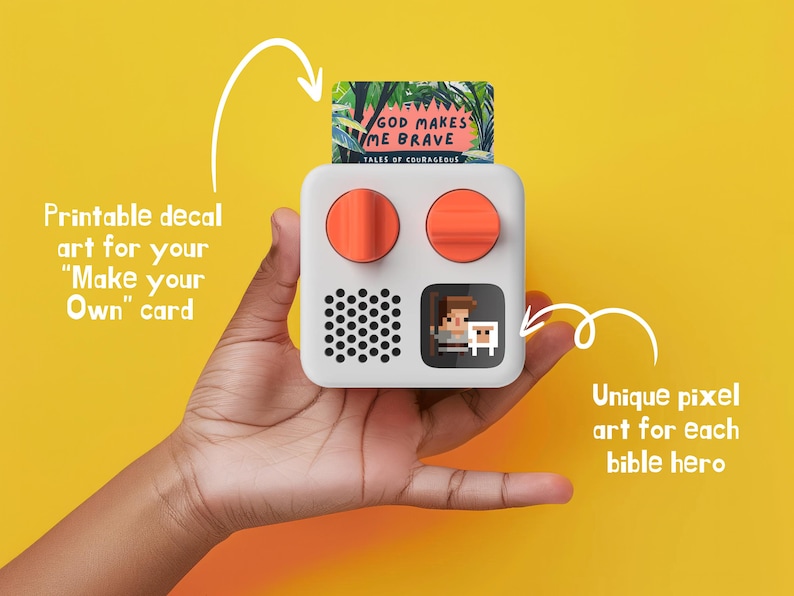 May include: A white, square-shaped device with two orange buttons and a pixelated image of a person and a sheep. The device has a black speaker grille and a slot for a card that says "God Makes Me Brave, Tales of Courageous".
