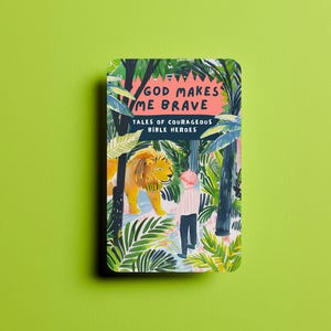 May include: A book cover with a jungle scene featuring a lion and a person. The title of the book is "God Makes Me Brave: Tales of Courageous Bible Heroes."