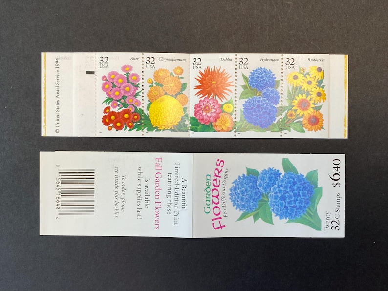 May include: A sheet of twenty 32-cent stamps featuring five different flower designs. The stamps are a limited edition print and feature a variety of fall garden flowers, including asters, chrysanthemums, dahlias, hydrangeas, and rudbeckia.