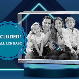 May include: A 3D crystal photo cube with a black and white image of a family of four. The cube is on a small LED base.  INCLUDED! SMALL LED BASE