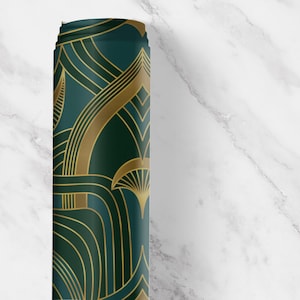 Close-up view of our Art Deco peel and stick drawer liner in a deep emerald green with metallic gold geometric fan and arch motifs. This vintage-inspired contact paper roll features bold 1920s style perfect for lining kitchen drawers, bar carts, shelves, or cabinets. The rich color and retro glam pattern add instant elegance and sophistication to any space. Ideal for renters and DIY decorators seeking classic Gatsby-era charm with easy application.