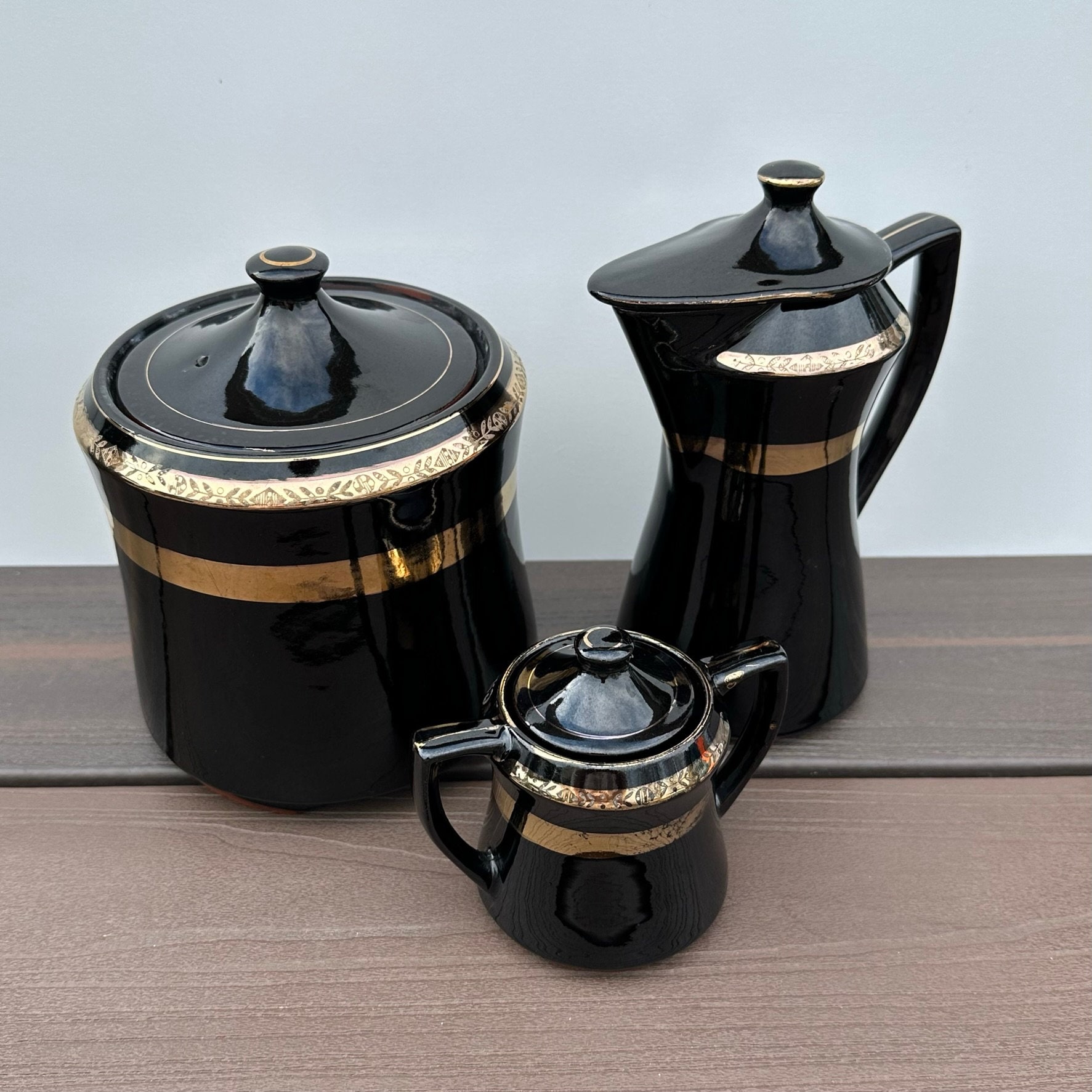 Darling 1950's Black and Gold Porcelain Set with Lidded Sugar Bowl, Cream Pitcher, and Coffee/Tea Tin