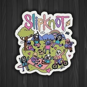 May include: A colorful sticker featuring the word "Slipknot" in a playful font, with a cartoon scene of people enjoying a picnic, riding a bike, and playing under a tree. The design includes a rainbow and hearts.