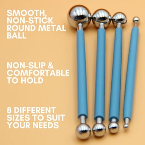 May include: Four metal ball tools with light blue handles and varying sizes of smooth, non-stick round metal balls. The image includes text: "SMOOTH, NON-STICK ROUND METAL BALL", "NON-SLIP & COMFORTABLE TO HOLD", and "8 DIFFERENT SIZES TO SUIT YOUR NEEDS".