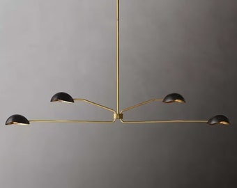 May include: A gold metal chandelier with five black dome-shaped shades. The chandelier has a long, straight central rod and four arms extending out from the center.