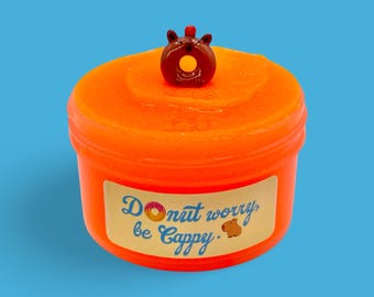 Donut worry be Cappy, donut themed capybara slime, comes with capybara donut charm, scented like jelly donuts, bright orange latex slime