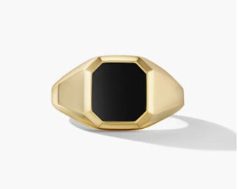 May include: A gold signet ring with a black onyx stone.