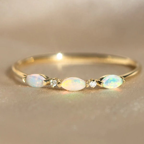 This opal and diamond ring has the perfect amount of fiery glow and stellar sparkle, all set in 9k solid yellow gold so you can wear it