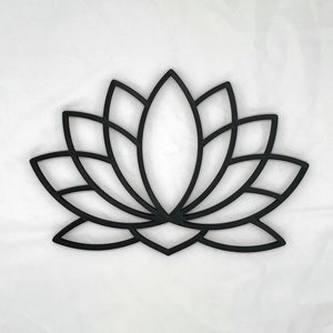 May include: Black metal lotus flower wall decor. The design is intricate and detailed, with a geometric pattern.