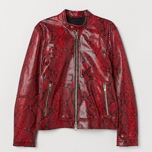 May include: A red leather jacket with a snakeskin pattern. The jacket has a zip closure and two zipped pockets on the sides.