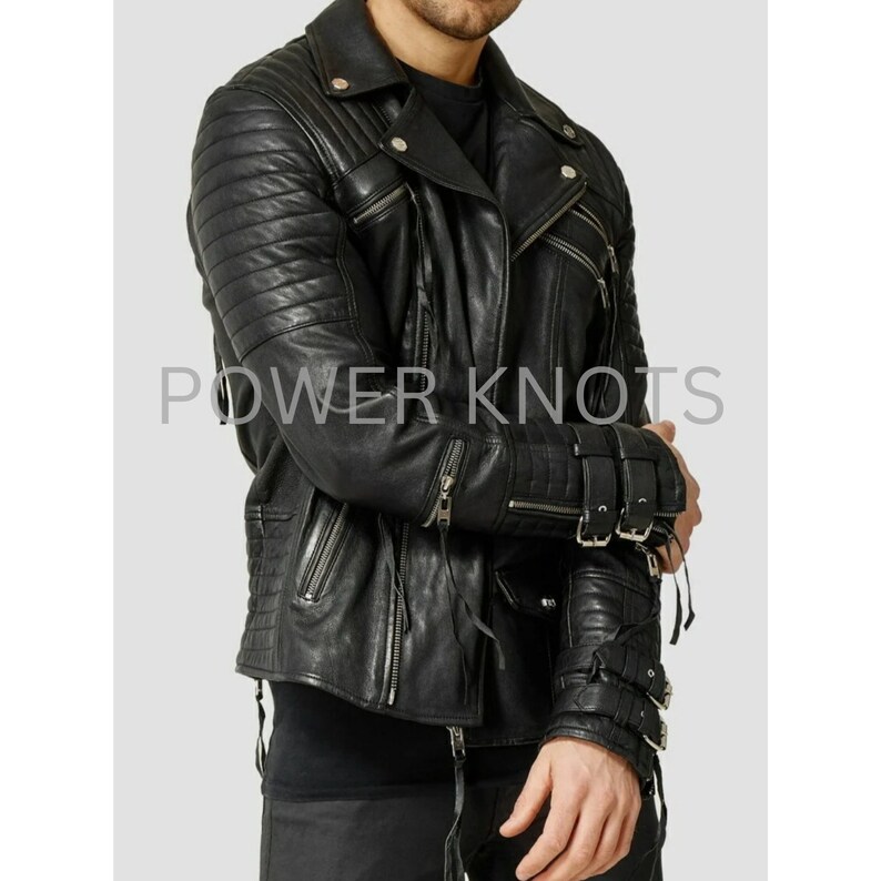 May include: Black leather motorcycle jacket with zippered pockets and buckle details on the sleeves. The jacket has a quilted design on the sleeves and a zipper closure.