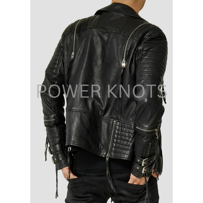 May include: Black leather motorcycle jacket with zipper details and a quilted design. The jacket has a stand-up collar, long sleeves, and a zipper closure. The jacket has a  "POWER KNOTS" logo on the back.