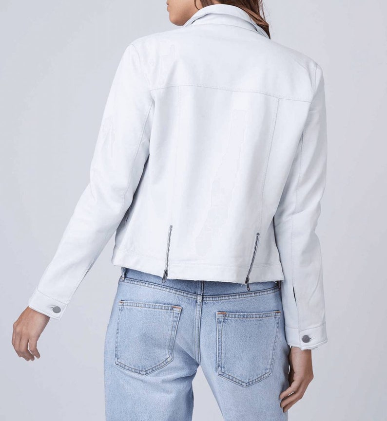 May include: A white leather jacket with a zipper closure and a slightly cropped hem.