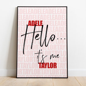 May include: A black and white printable wall art print with the text "Hello... it's me" in a handwritten style. The background is a pink pattern of the words "Adele" and "Taylor" repeated.