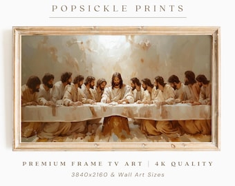 May include: A framed print of "The Last Supper" painting. The artwork depicts Jesus and his disciples at a table, rendered in warm, neutral tones. The frame is a light wood color, and the text "POPSICLE PRINTS" is at the top.