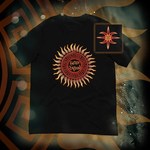 May include: Black t-shirt with a sun design and Greek text in a circular pattern. The sun design is in orange and yellow hues. A smaller square image of a similar design is in the top right corner.