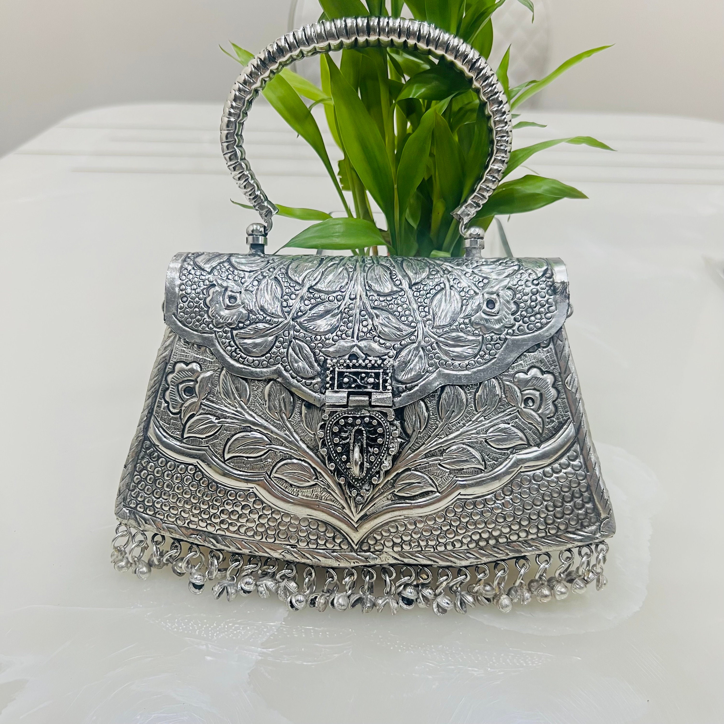 Buy Silver Brienne Metallic Clutch by Sephyr Online at Aza Fashions.