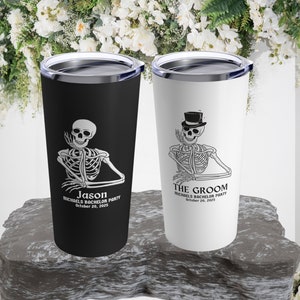 May include: Two black and white stainless steel tumblers with a skeleton graphic. One tumbler says "Jason Michaels Bachelor Party October 20, 2025" and the other says "The Groom Michaels Bachelor Party October 20, 2025".