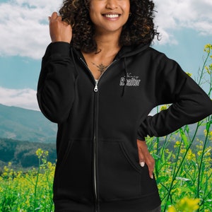 May include: Black zip-up hoodie with the text "Virtual Realtor" in white lettering on the front.