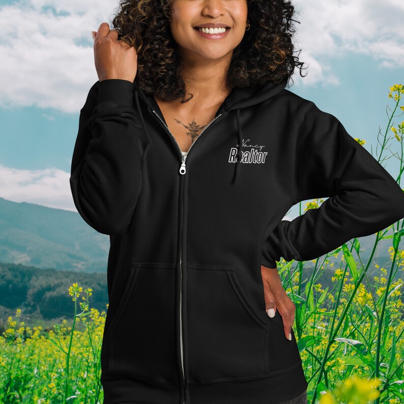 May include: Black zip-up hoodie with the text "Virtual Realtor" in white lettering on the front.