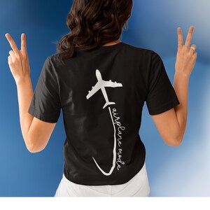 May include: Black t-shirt with a white airplane graphic and the text "airplane mode" written vertically.