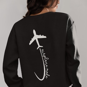 May include: Black sweatshirt with a white airplane graphic and the text "airplane mode" on the back.