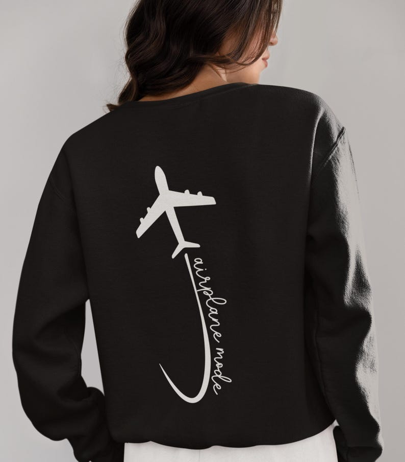 May include: Black sweatshirt with a white airplane graphic and the text "airplane mode" on the back.