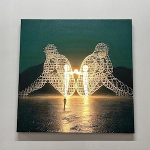May include: A glowing wireframe sculpture of two figures facing each other, with a smaller figure walking towards them in the foreground. The sculpture is set against a dark green background with a faint mountain range in the distance. The ground is a reflective surface with a golden hue.