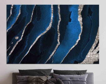May include: Abstract art print featuring a blue and silver watercolor design. The print has a modern and contemporary style.