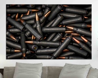 May include: A close-up image of a pile of spent bullet casings. The casings are made of metal and have a copper-colored tip. The casings are arranged in a random pattern, creating a chaotic and dangerous aesthetic.