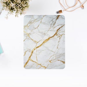 May include: A white marble phone case with gold veins. The case has a smooth, glossy finish.