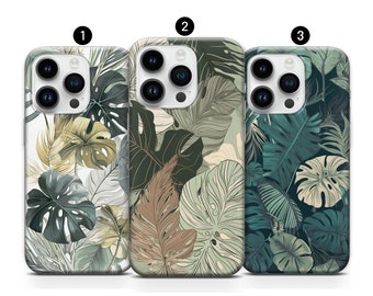 May include: Three different phone cases with a tropical leaf pattern. The cases are white, brown, and green.