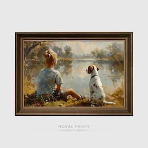 Puede incluir: Obra de arte enmarcada que representa a un niño y un perro junto a un lago. El niño, con una camisa azul claro, está sentado de espaldas al espectador. El perro, blanco con manchas marrones, está sentado a su lado. La obra está enmarcada en un marco marrón oscuro. El texto "NOVAL PRINTS" está en la parte inferior.