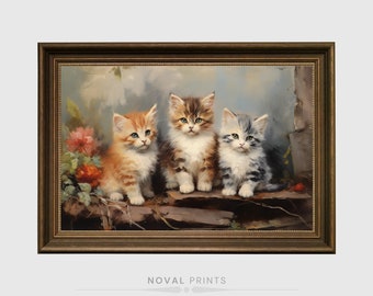 May include: A framed painting of three kittens sitting on a rock. The kittens are a tabby, a calico, and a white kitten with gray markings. The kittens are looking at the viewer. The painting is set against a background of a blue sky and green foliage.