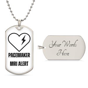 May include: A silver-colored dog tag pendant with a heart and lightning bolt graphic, and the words "PACEMAKER MRI ALERT". A second, blank dog tag is included, with the words "Your Words Here". The pendant hangs from a silver chain.
