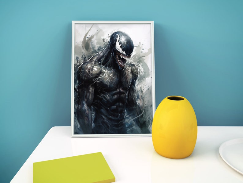 May include: A framed print of a black and white illustration of Venom, a Marvel Comics superhero, with a menacing expression. The background is a watercolor-style wash of gray and white.