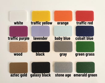 May include: A color palette featuring rectangular swatches in various colors, including white, yellow, orange, red, purple, lavender, baby blue, and cobalt blue. Additional colors include wood, black, gray, green grass, aztec gold, galaxy black, stone age, and emerald green.