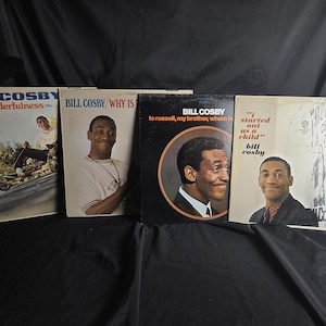 May include: Four vintage vinyl record albums by Bill Cosby. The covers feature titles including Wonderfulness, Why Is There Air, To Russell, My Brother, Whom I Slept With, and I Started Out As A Child, each displaying photographic portraits of the artist.