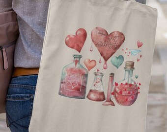 May include: A beige tote bag with a watercolour design of hearts and potion bottles in red, pink, and teal. The design includes the word "Organic" on one of the hearts. The bag is carried by a person.