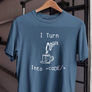 May include: A blue t-shirt with a white graphic of a coffee cup and the text "I Turn Coffee Into  <CODE/>"
