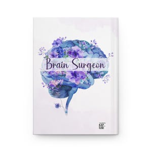 Watercolor Brain Art Journal with floral brain anatomy design. Features birth month floral patterns, customizable name option, perfect for psychology students, medical students, neurologists, ICU nurses, and neurosurgery professionals. Ideal for note-taking, therapy sessions, and cognitive science studies. Personalized journal celebrating brain anatomy and neuroscience.