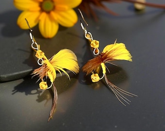 More available . Brilliant golden colors w/a touch of brown in t/feathers. Attached are 4 yellow Swarovski Crystal beads