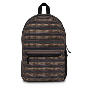 May include: A backpack featuring a dark navy blue base with horizontal bands of intricate geometric patterns in shades of tan, brown, and cream. The bag includes a large main compartment, a smaller front zippered pocket, and a black top handle.
