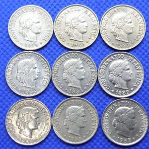 SWITZERLAND COIN GROUP - 9 x Five Rappen Coins - Date Range 1914 to 1955 - Very Good Quality Group. Swiss Coinage Currency (RR06)