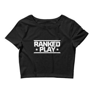 May include: Black cropped t-shirt with white text that reads "RANKED *PLAY*" with stars on either side of the word "PLAY".