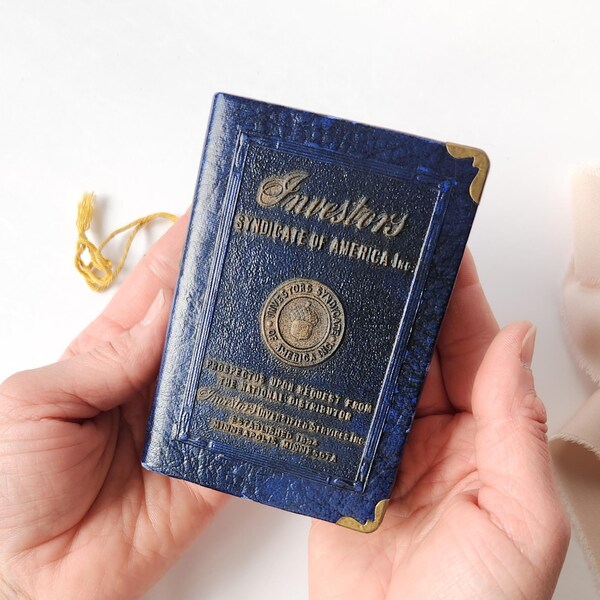 Salvadanaio a forma di libro Vintage Investors Syndicate, strumento di risparmio promozionale Zell