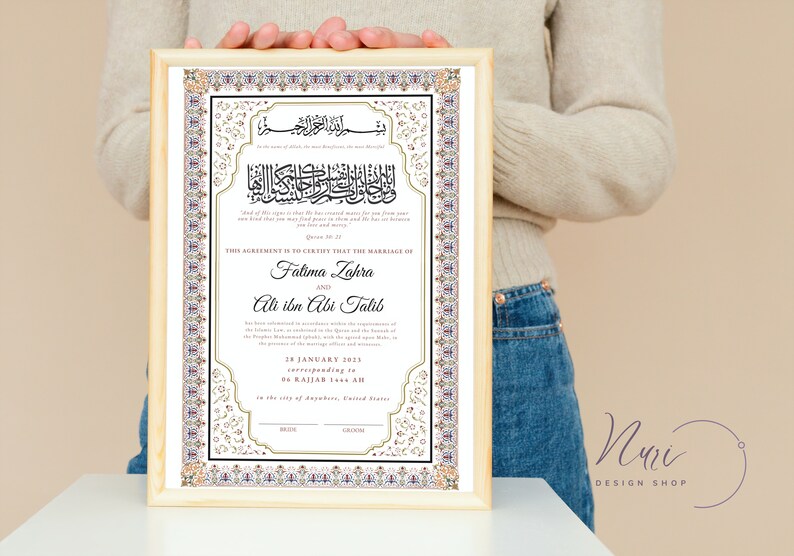May include: A framed Islamic marriage certificate with ornate gold and white calligraphy. The text includes the names Fatima Zahra and Ali ibn Abi Talib, the date 28 January 2023, and the phrase "This agreement is to certify that the marriage of..."