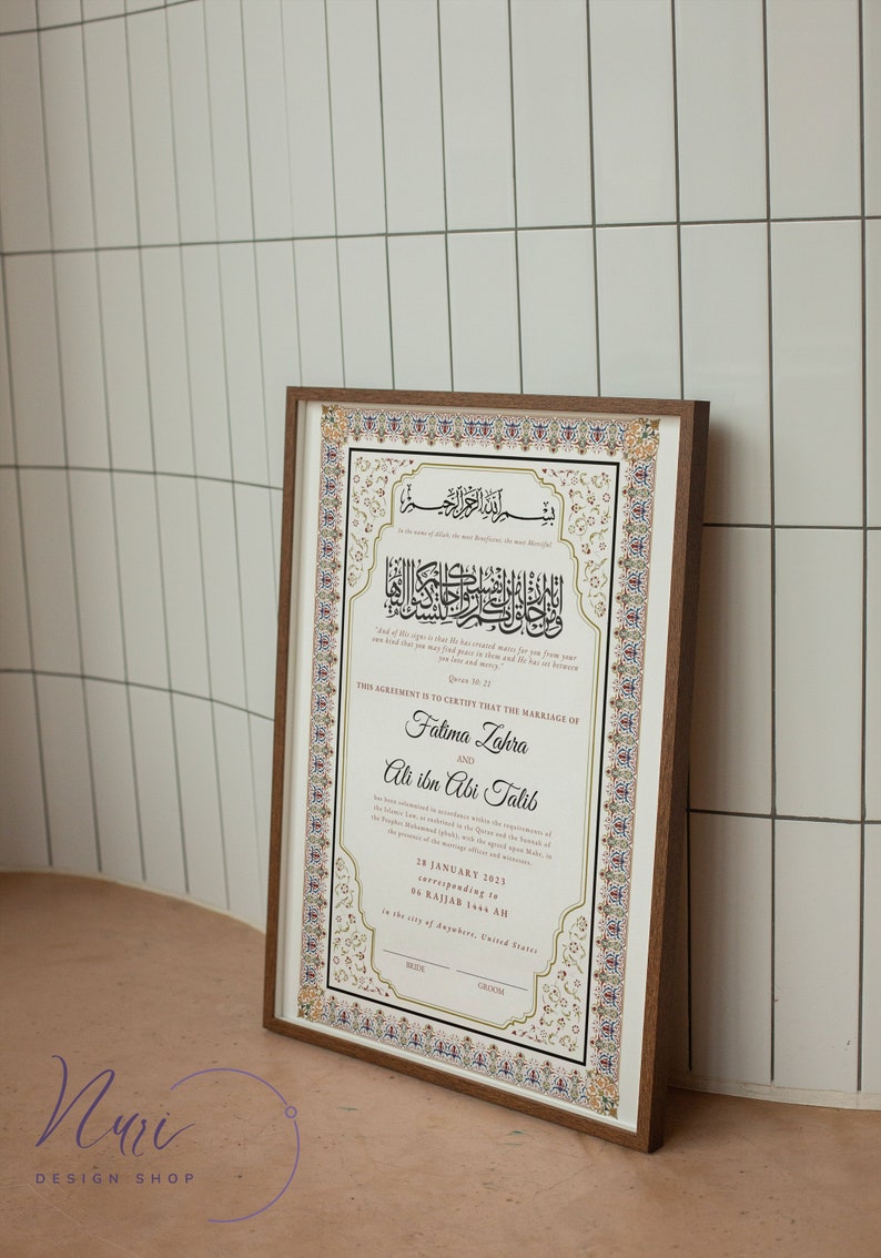 May include: A framed Islamic marriage certificate with ornate gold and white calligraphy. The text reads "This agreement is to certify that the marriage of Fatima Zahra and Ali ibn Abi Talib." The date is 28 January 2023, corresponding to 06 Rajab 1444 AH. The city of marriage is in the city of Anywhere, United States.