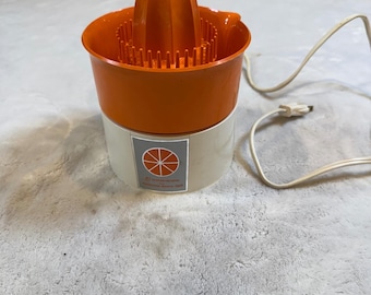 Exprimidor eléctrico vintage Dominion Hamilton Beach Scovill, modelo 2109.3 MCM, color naranja.