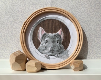 May include: A watercolor painting of a gray chinchilla peeking out of a round opening, framed by a natural wood hoop. The chinchilla has pink ears and is set against a brown background. Three geometric wooden blocks are in the foreground.
